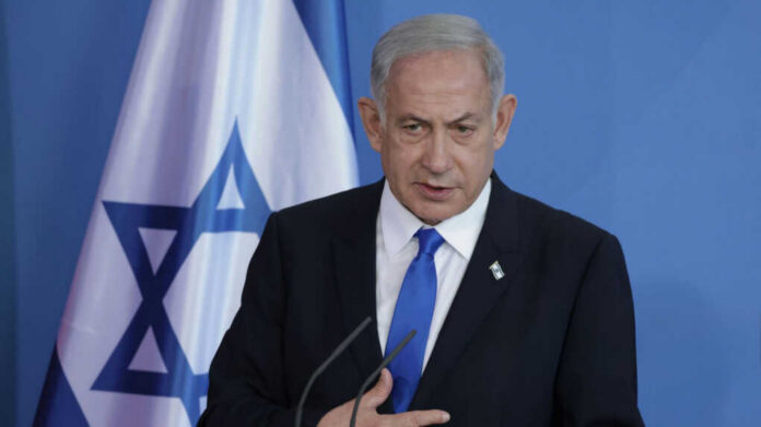 Israeli-Prime-Minister-Benjamin-Netanyahu_2458279225 Man speaking in front of Israeli flag backdrop
