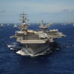 Aircraft carrier leads a naval fleet at sea