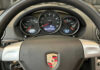 Porsche’s EV Dream CRASHES—99% Profit Wipeout Porsche steering wheel with instrument cluster