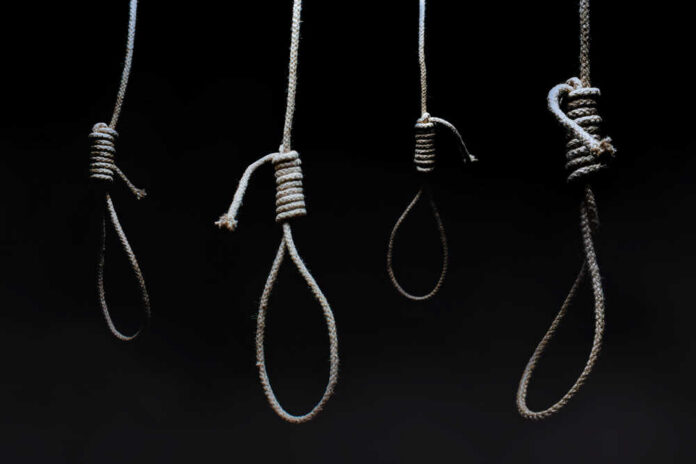 Horror,Photo,Of,A,Dark,Scary,Hanging,Nooses,On,Black Four nooses hanging against a dark background