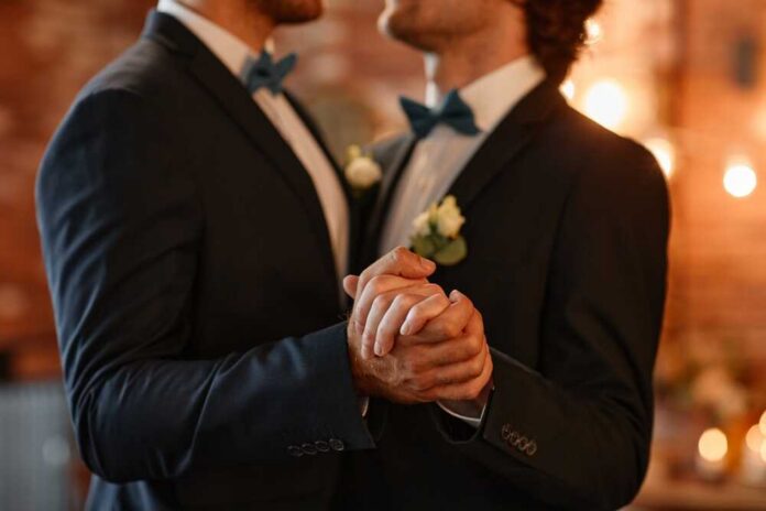 Close,Up,Of,Male,Gay,Couple,Dancing,Together,During,Wedding Elections office glass door with Texas state seal