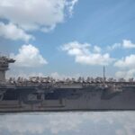 USS Theodore Roosevelt Deploys With Unmanned Vessel Aircraft carrier leads a naval fleet at sea