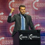 Person speaking at Turning Point USA event podium