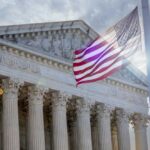 SCOTUS Showdown: AR-15 Rights On Trial The Supreme Court building with an American flag waving in front