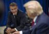 Macron’s Versailles Power Play Two political leaders engaged in a conversation, one smiling