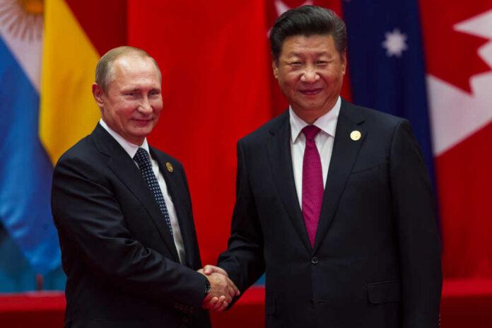 Hangzhou,,China,-,Sept.,4.,2016,-,Chinese,President,Xi Two international leaders shaking hands at a diplomatic event