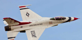 USAF fighter jet in flight with red, white, and blue livery