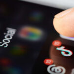 Phone screen with TikTok app and notifications