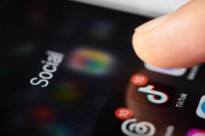 Phone screen with TikTok app and notifications