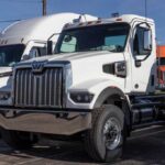 White heavy-duty semi truck in a dealership lot