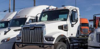 White heavy-duty semi truck in a dealership lot