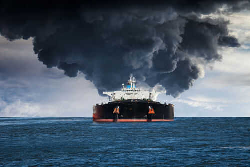 burning-tanker-ship293077058 Large ship emitting thick black smoke at sea