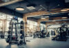 Influencer’s Brutal Belt Beatdown — Guilty Modern gym with fitness equipment and weight racks