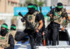 UN Bombshell: Hamas Blocks Lifesaving Aid Masked men with firearms standing on a vehicle