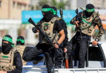 UN Bombshell: Hamas Blocks Lifesaving Aid Masked men with firearms standing on a vehicle