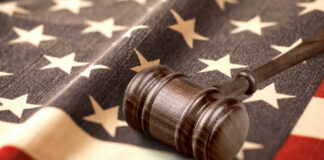 Judge’s gavel on a folded American flag