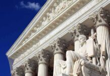 Supreme Court building facade with statue and columns