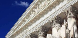 Supreme Court building facade with statue and columns