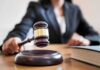 Courthouse Romance Sparks Corruption Bombshell Judge's gavel striking sound block on courtroom desk