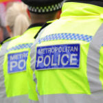 Free Speech Shock: Armed Arrest, Big U-Turn Two police officers in high-visibility jackets at a public event