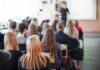 Student Brag Triggers Federal Crime Alarm Students seated in a classroom listening to a presentation