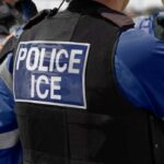 Missing Video Ignites Houston ICE Firestorm Close-up of a police officer's vest with 'POLICE ICE' label