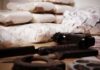 Banana Box Bust Stuns Italian Port Piles of bagged powder with a handgun on a table