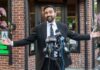 ‘Monsters’ Remark Ignites AIPAC Backlash Man in a suit speaking at outdoor press conference with multiple microphones