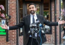 ‘Monsters’ Remark Ignites AIPAC Backlash Man in a suit speaking at outdoor press conference with multiple microphones