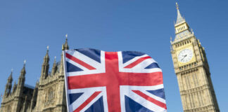 Union Jack flag in front of Big Ben and the Houses of Parliament