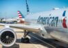 Surveillance Scorecards Hit American Airlines Commercial airplane at airport gate with engine and fuselage visible