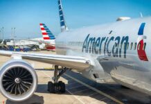 Surveillance Scorecards Hit American Airlines Commercial airplane at airport gate with engine and fuselage visible