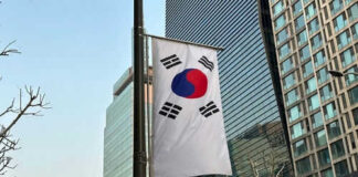 South Korean flag hanging among tall buildings