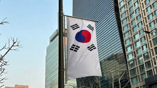south-korea2284026351 South Korean flag hanging among tall buildings