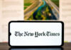 NYT Hit With Bias Charge—Then Strikes Back Smartphone displaying The New York Times logo