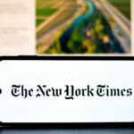 NYT Hit With Bias Charge—Then Strikes Back Smartphone displaying The New York Times logo