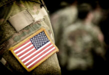 FDA Turbocharge On PTSD Treatments American flag patch on military uniform