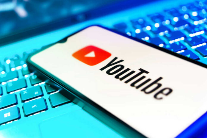 youtube-logo-smartphone2518659479jpg YouTube app on smartphone over illuminated laptop keyboard