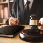 Influencer Brawl Derails Kirk Case Facts Judge with gavel striking sound block