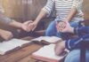 Aid For Everyone—Except Ministry Majors? People holding hands around open books on a table