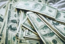 Wealth Tax Backfires? Cuban Sounds Alarm Stacks of U.S. hundred-dollar bills