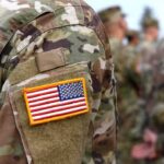 U.S. flag patch on a camouflage military uniform