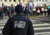 Police officer monitoring a protest on a city street