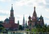 Stealthy Su-35 Hand-Off — Russia Hides The Count Saint Basil's Cathedral and Kremlin towers under a cloudy sky