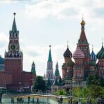 Saint Basil's Cathedral and Kremlin towers under a cloudy sky