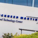 Defense Giants JOLTED — Clock’s Ticking Lockheed Martin Advanced Technology Center building sign