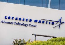 Defense Giants JOLTED — Clock’s Ticking Lockheed Martin Advanced Technology Center building sign