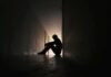 Ben Affleck’s Addiction Take Triggers Firestorm Silhouette of a person sitting on the floor in a dim hallway