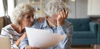 Older couple reviewing bills at home