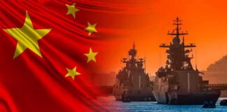 Chinese flag overlaid on warships at harbor during sunset